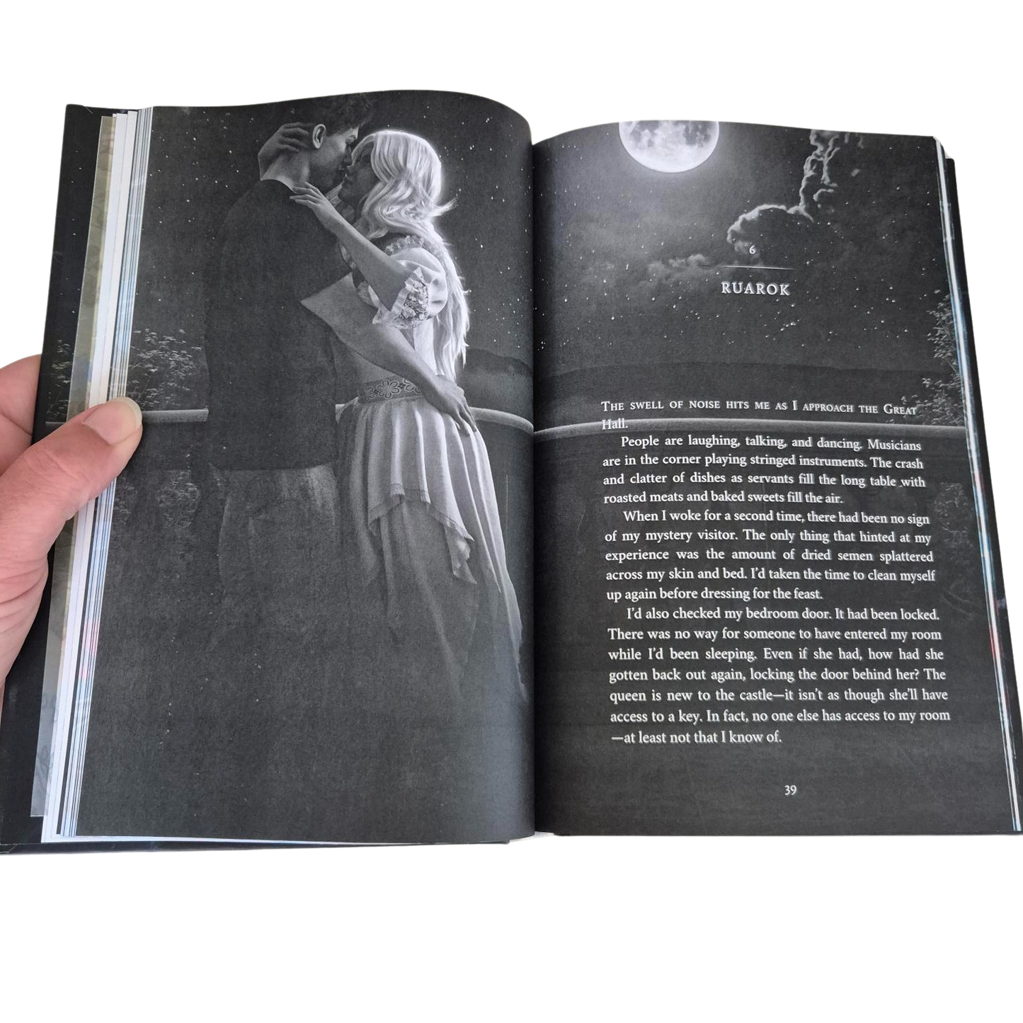 Open book with a black and white illustration of a couple embracing and text on a white background
