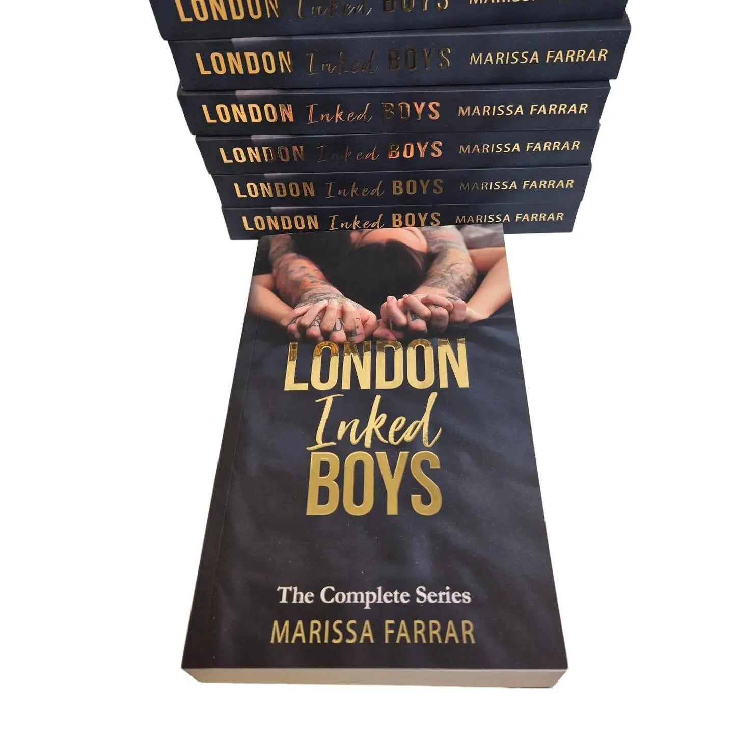 Stack of 'London Inked Boys' books by Marissa Farrar on a white background