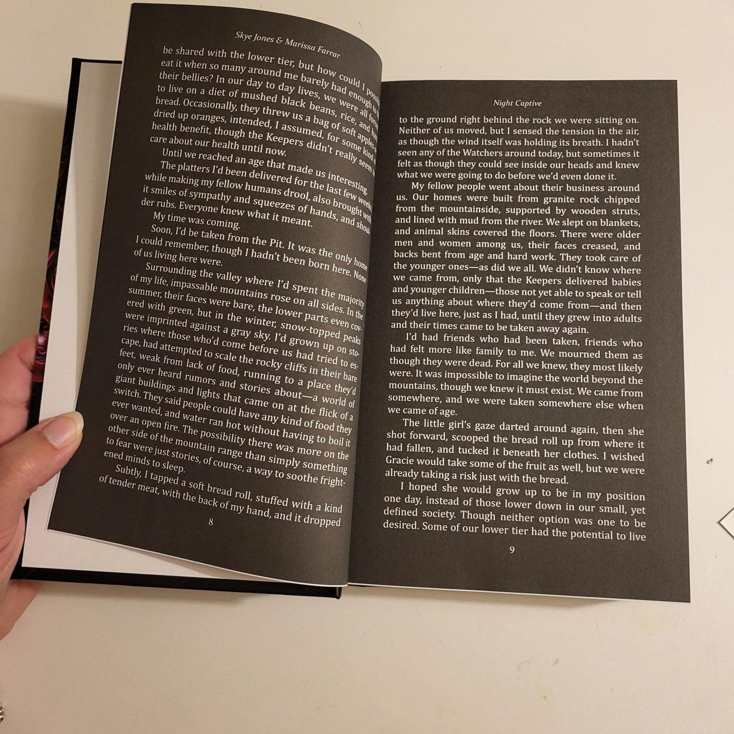 Interior of Wicked Monsters showing black pages with white text