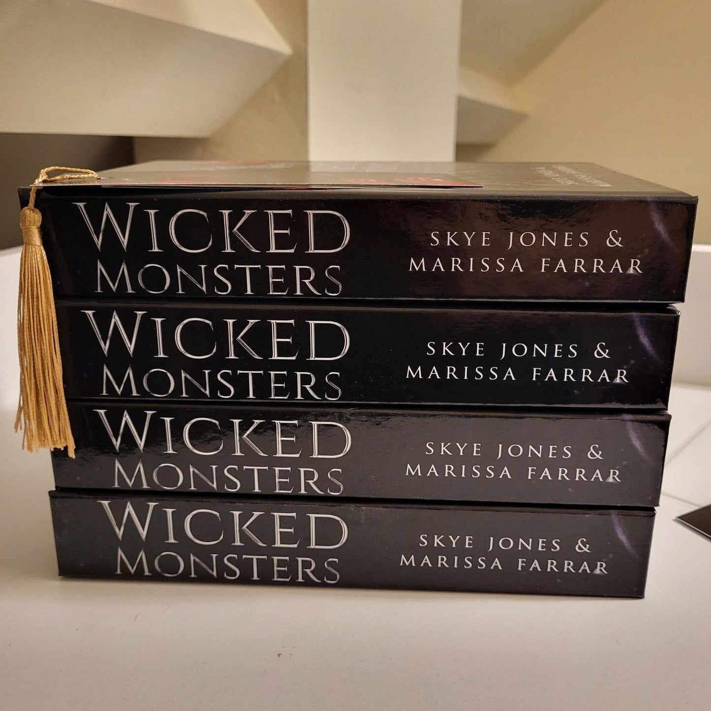 Stack of four Wicked Monsters hardback books