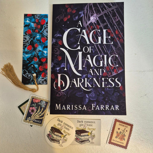 Book titled 'A Cage of Magic and Darkness' by Marissa Farrar with related items on a light surface.