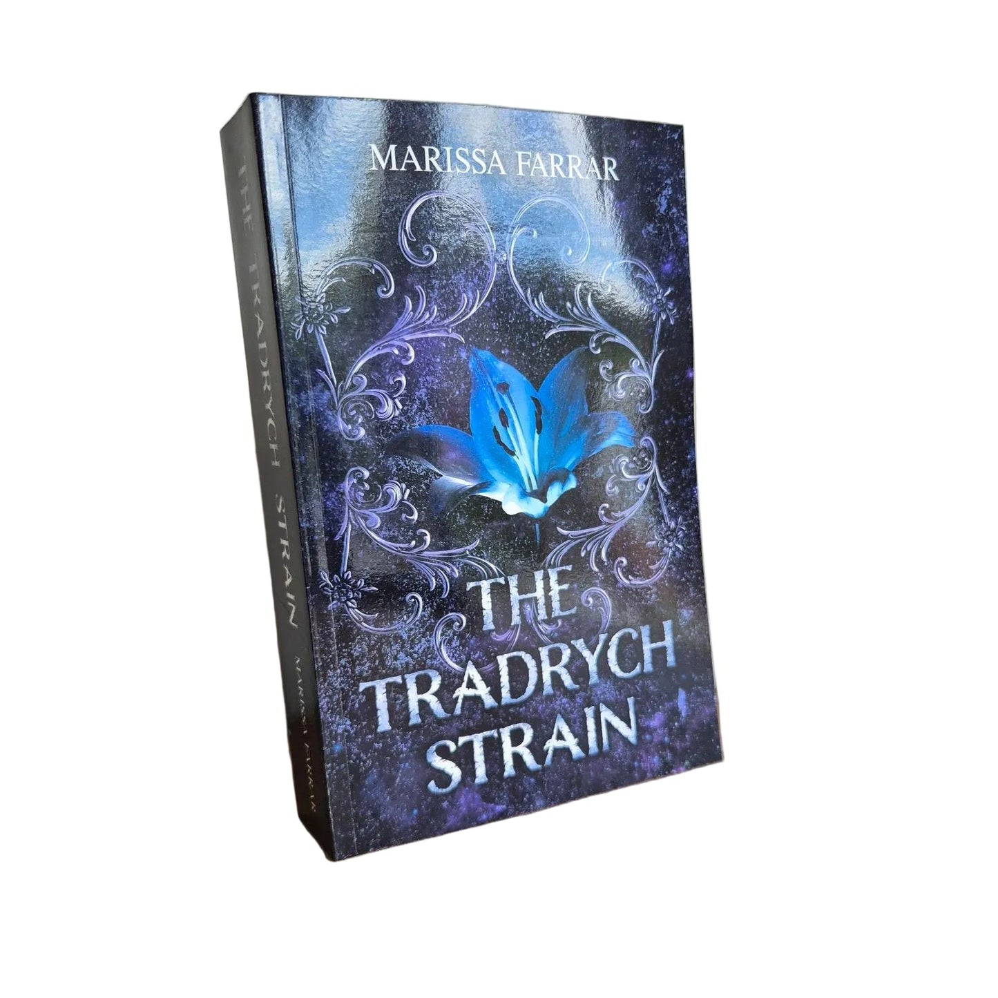 Book titled 'The Tradrych Strain' by Marissa Farrar in paperback