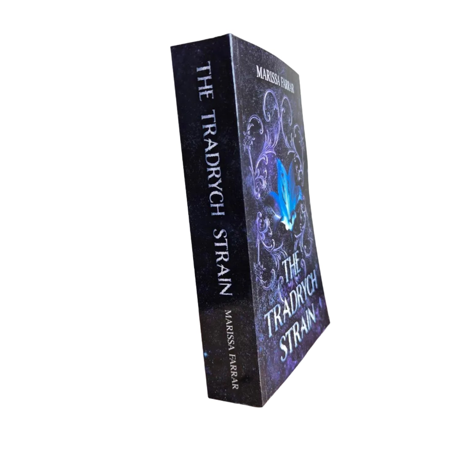 Book titled 'The Tradrych Strain' by Marissa Farrar in paperback.