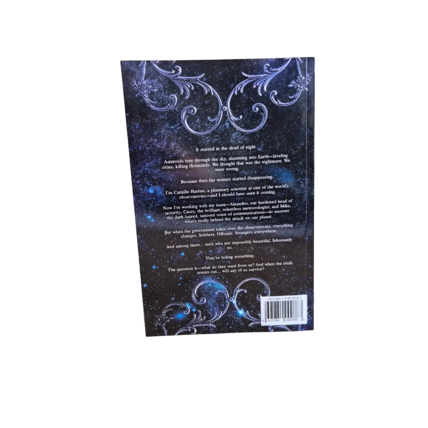 Book cover with decorative elements on a wooden surface