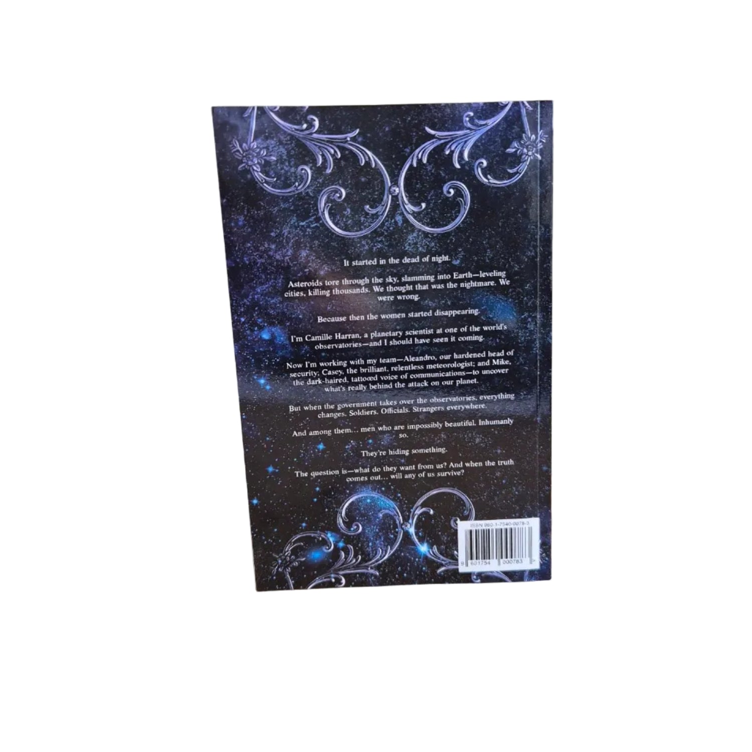 Book cover with decorative elements on a wooden surface