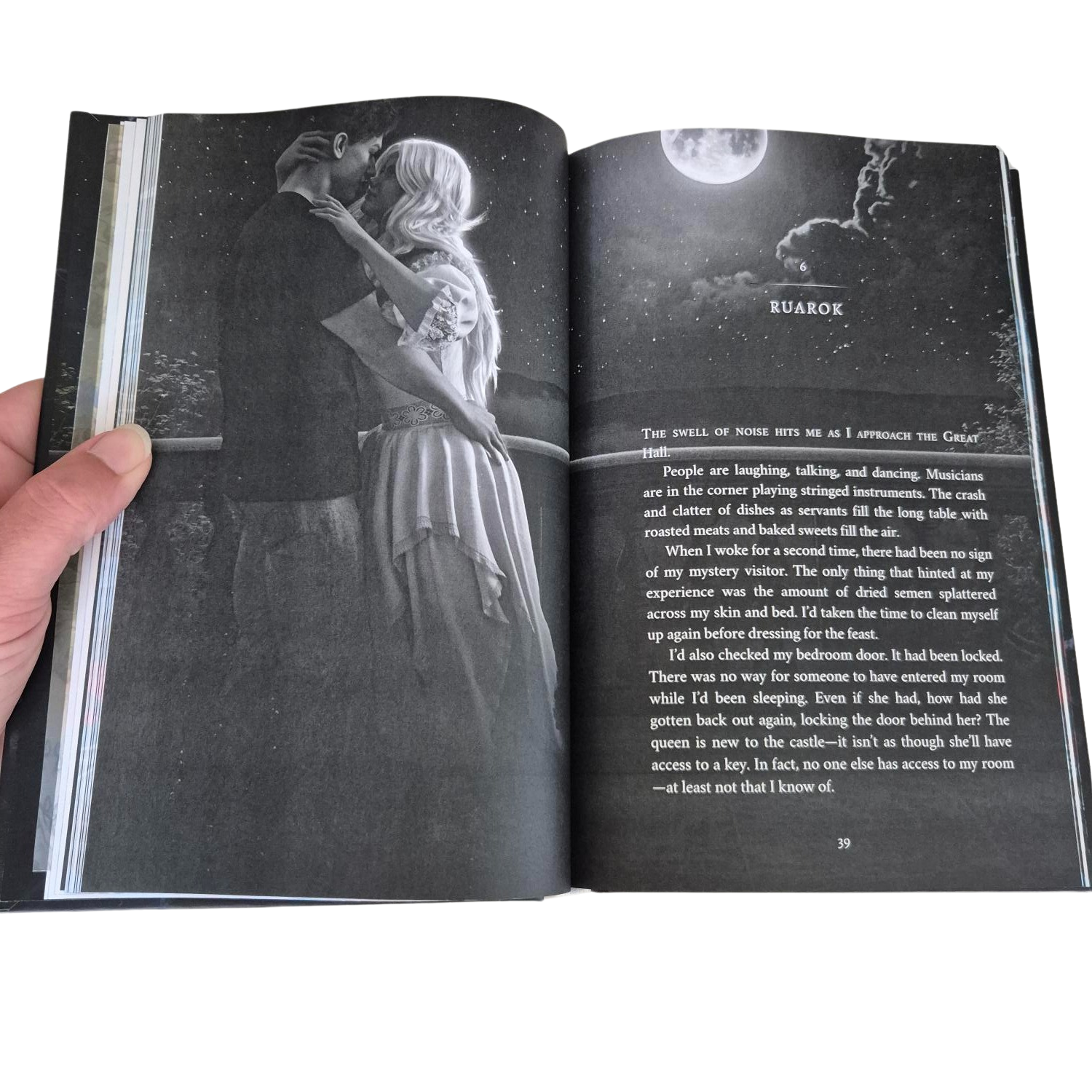 Open book with a black and white illustration of a couple embracing and text on a white background