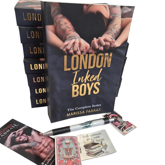 Stack of books titled 'London Inked Boys' with promotional materials on a white background
